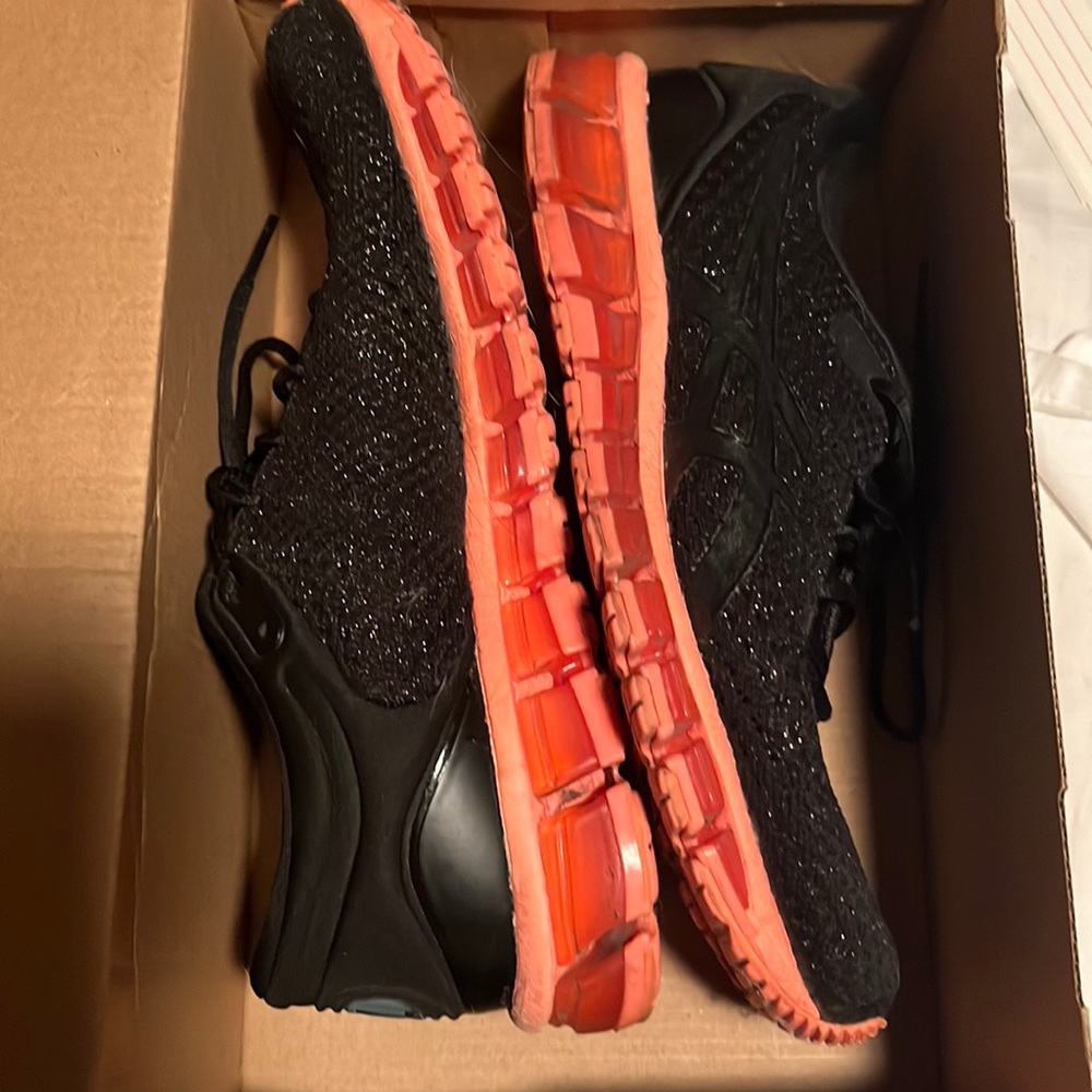Woman’s tennis shoe gently worn